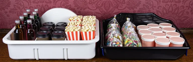 A food-safe plastic organiser tray and usherette tray carrying products.